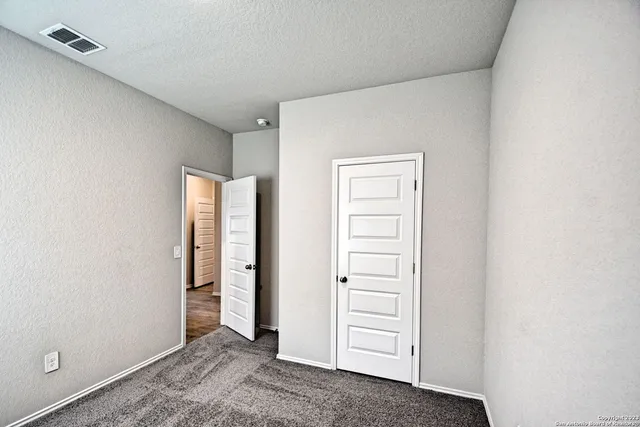 wooden floor and closet in a room