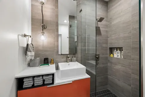 a bathroom with a sink and a mirror