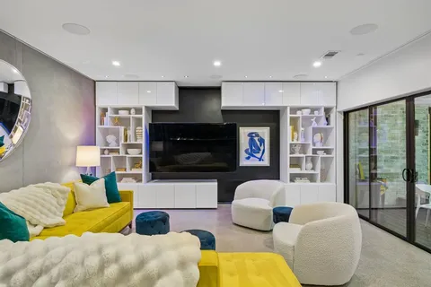 a living room with furniture flat screen tv and a fireplace
