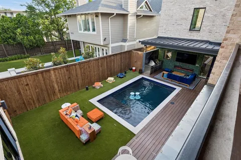 a view of a wooden deck with furniture