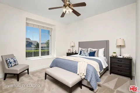 a kitchen with stainless steel appliances granite countertop a sink and a refrigerator