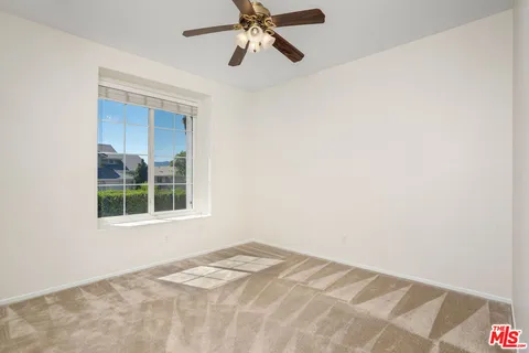 a large kitchen with kitchen island a sink stainless steel appliances and cabinets