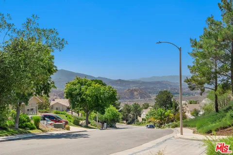 a living room with furniture a rug and a window