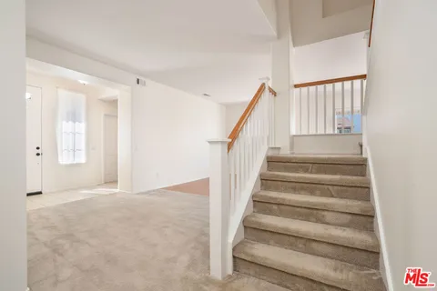 a spacious bathroom with a double vanity sink a mirror and a bathtub
