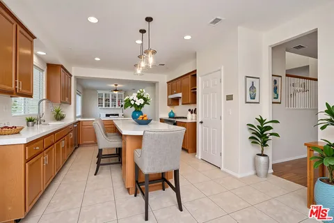 a kitchen with a sink and wooden cabinets