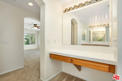 a bathroom with a bath tub with a toilet