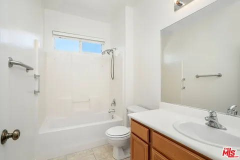 a view of balcony with wooden floor and a potted plant
