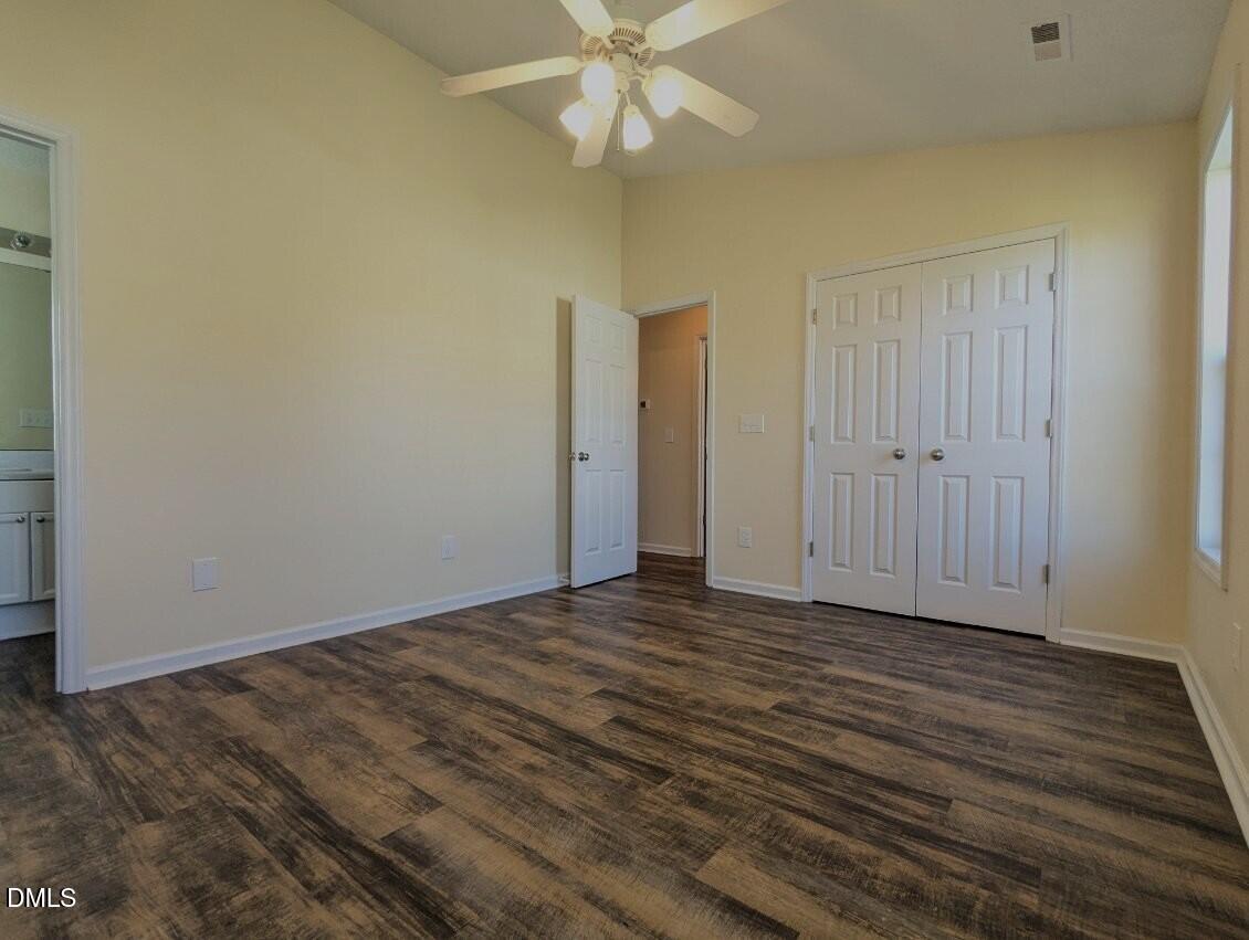 100 Reebe Circle Selma, NC 27576 - Photo 12 of 19 a view of an empty room with wooden floor
