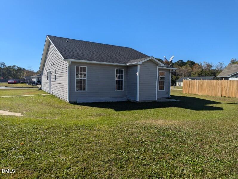 100 Reebe Circle Selma, NC 27576 - Photo 18 of 19 a front view of a house with garden