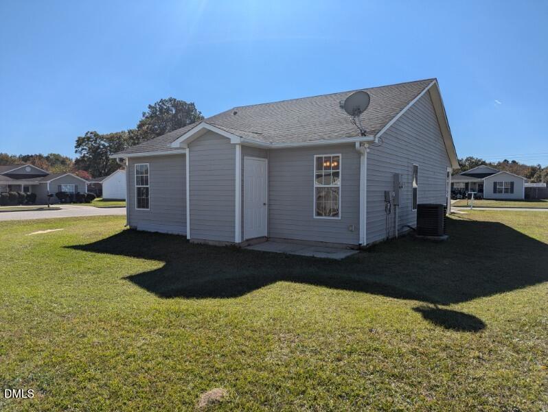 100 Reebe Circle Selma, NC 27576 - Photo 19 of 19 a front view of a house with garden
