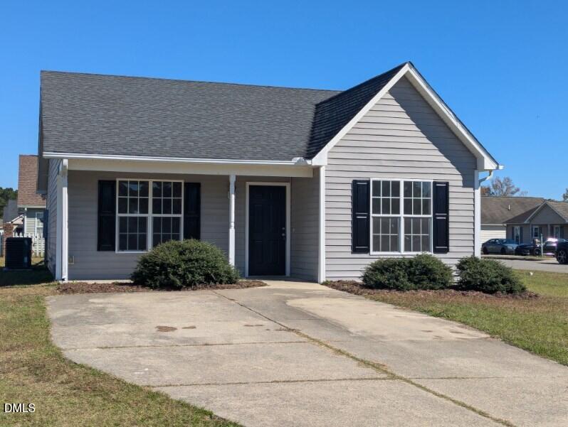 100 Reebe Circle Selma, NC 27576 - Photo 2 of 19 a front view of a house with garden