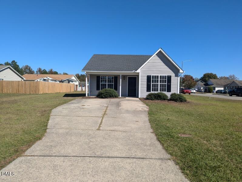 100 Reebe Circle Selma, NC 27576 - Photo 4 of 19 a front view of a house with a yard