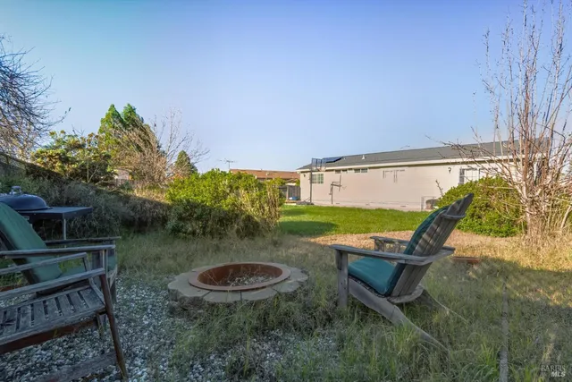 swimming pool view with a seating space
