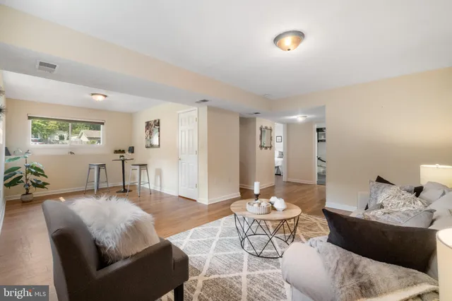 a spacious bedroom with a bed and a large window