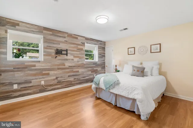 a bedroom with a bed and a walk in closet