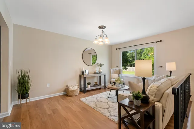 a view of a livingroom with furniture and a window