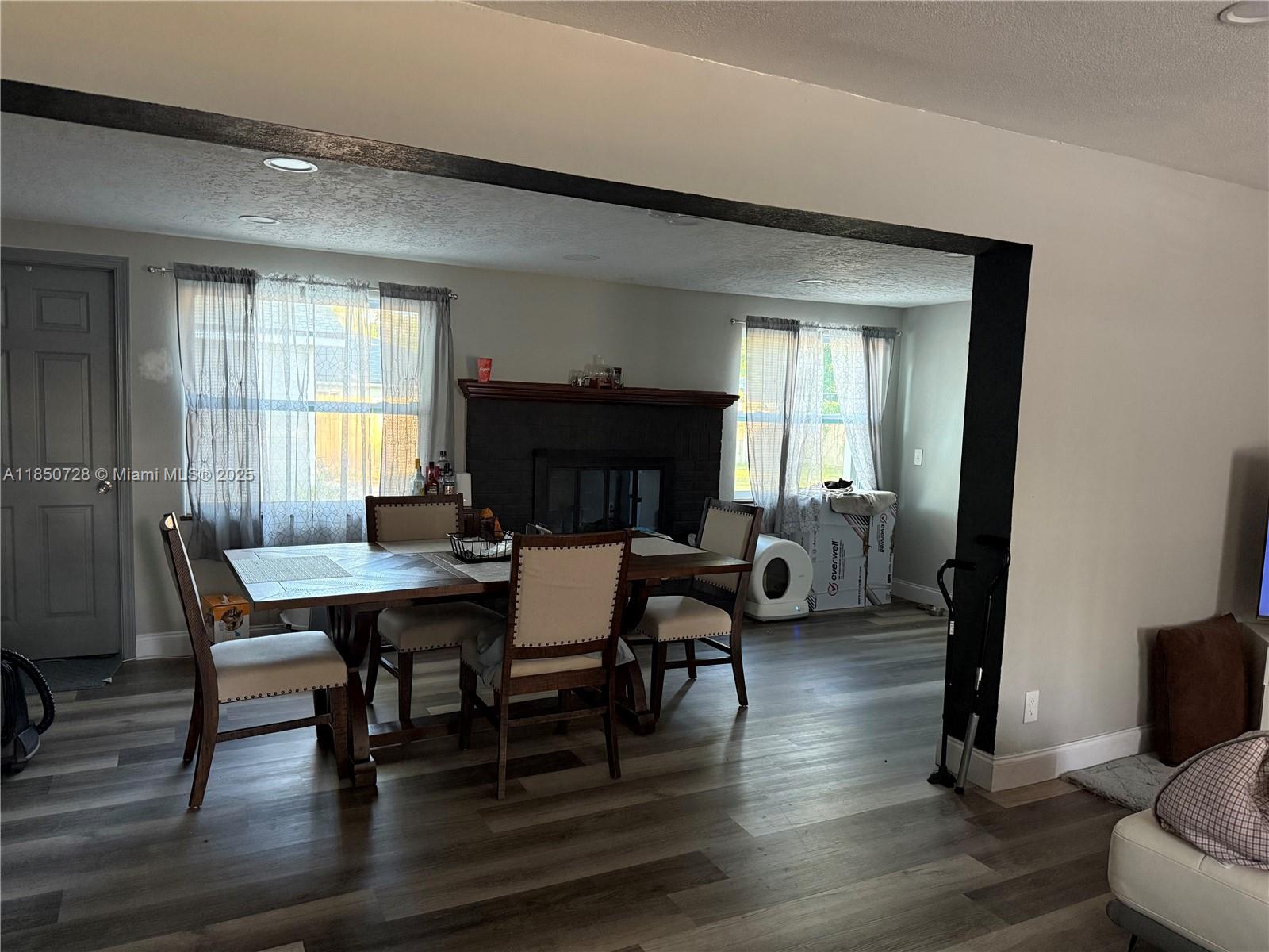 2514 Gayland Road Jacksonville, FL 32218 - Photo 3 of 11 a view of a dining room with furniture and wooden floor