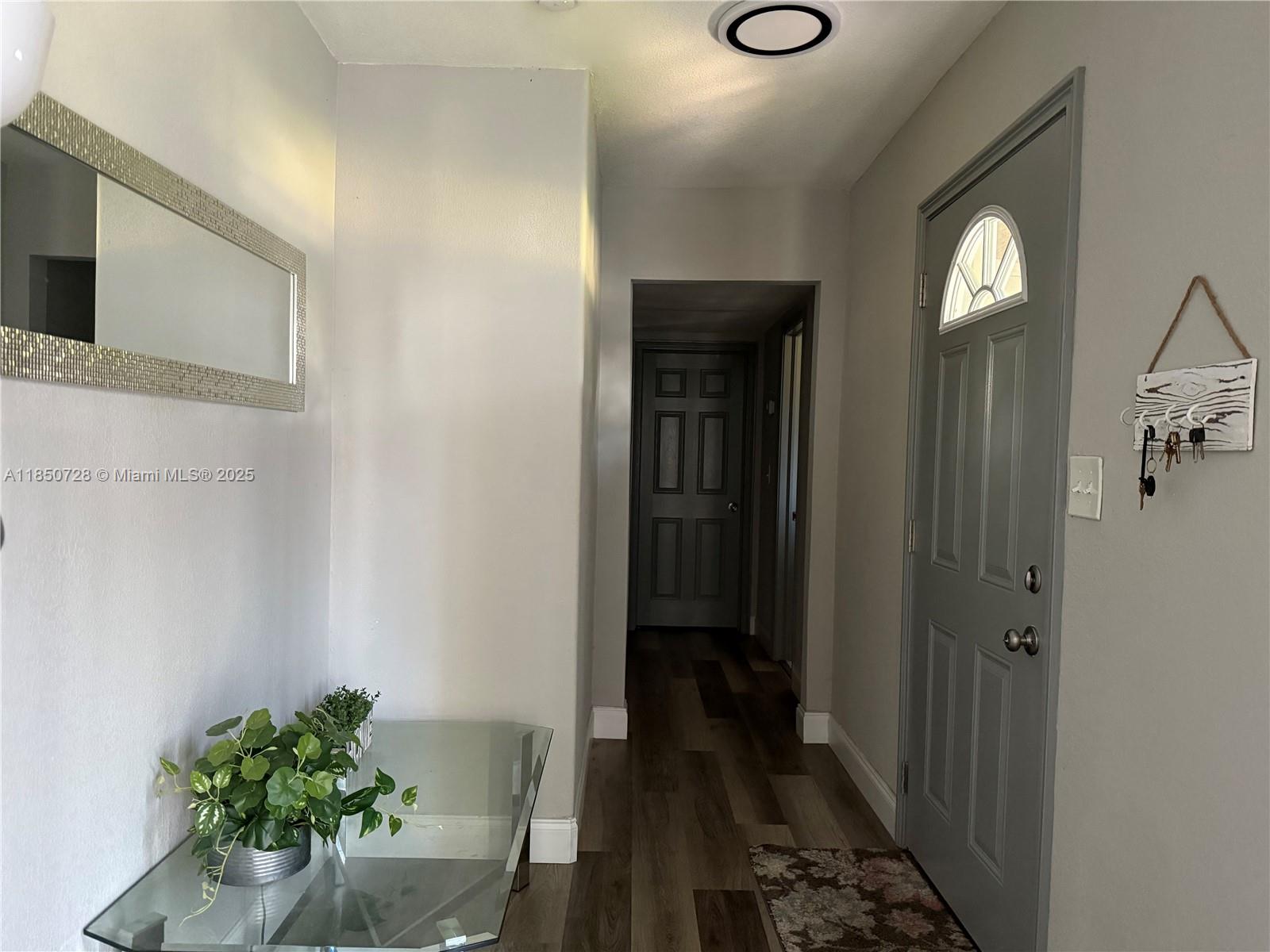 2514 Gayland Road Jacksonville, FL 32218 - Photo 4 of 11 a view of a hallway to a livingroom with furniture