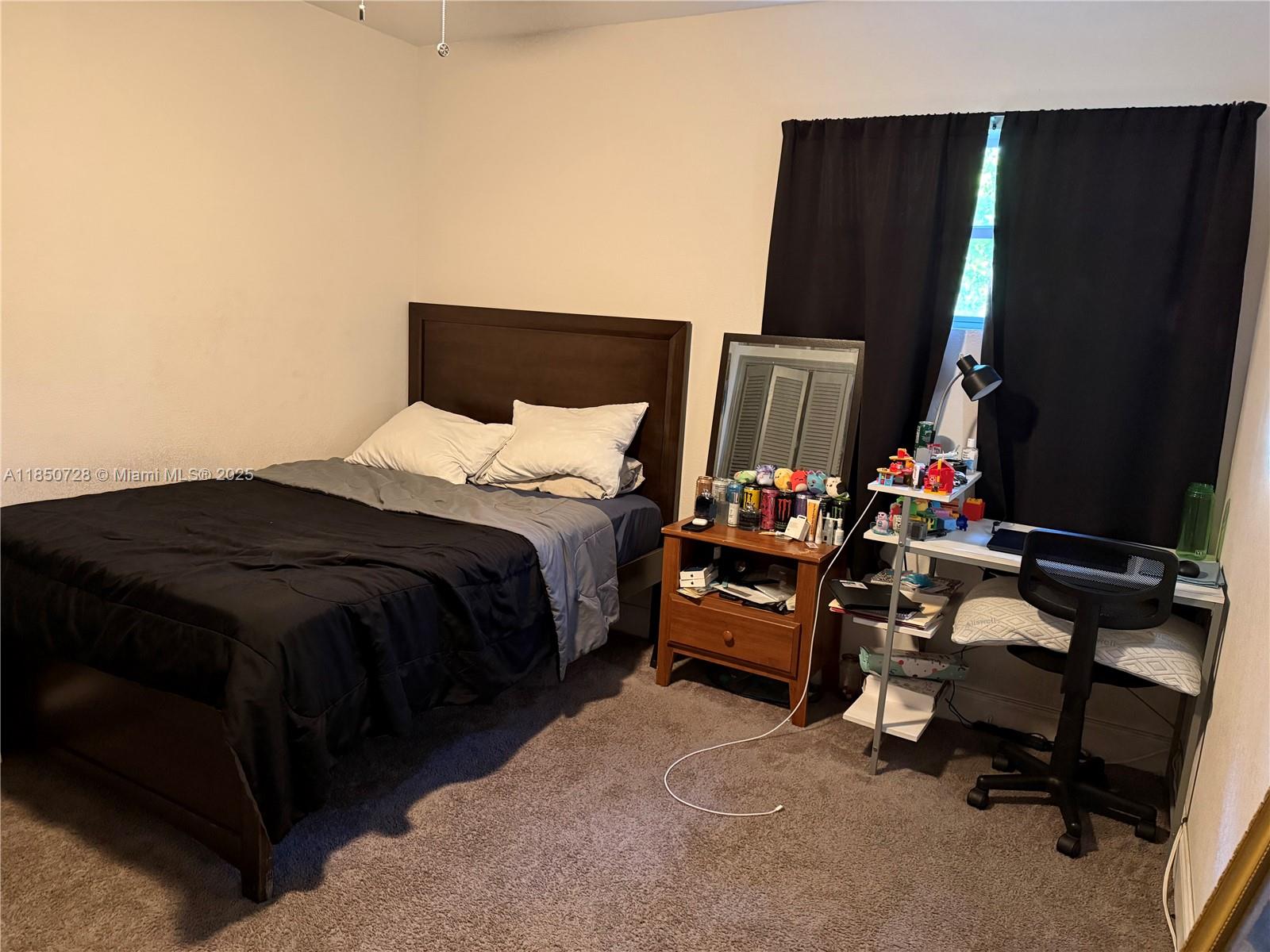 2514 Gayland Road Jacksonville, FL 32218 - Photo 6 of 11 a bedroom with a bed and a television