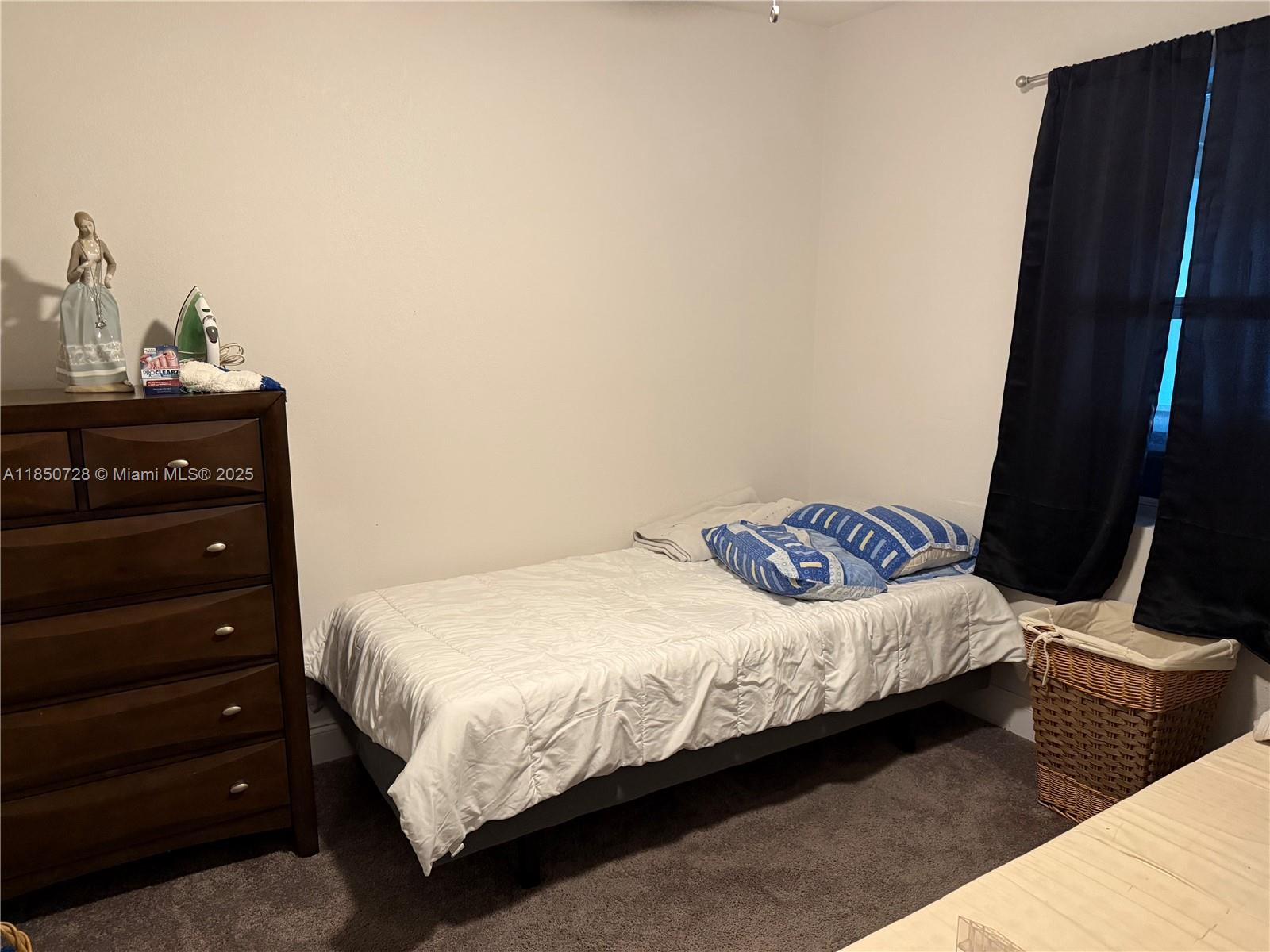 2514 Gayland Road Jacksonville, FL 32218 - Photo 7 of 11 a bedroom with a bed and a dresser