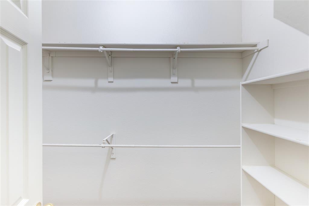 12680 Hillcrest Road, Unit 4101 Dallas, TX 75230 - Photo 21 of 37 Spacious closet featuring two clothing rods for hanging storage and built-in shelving for organization
