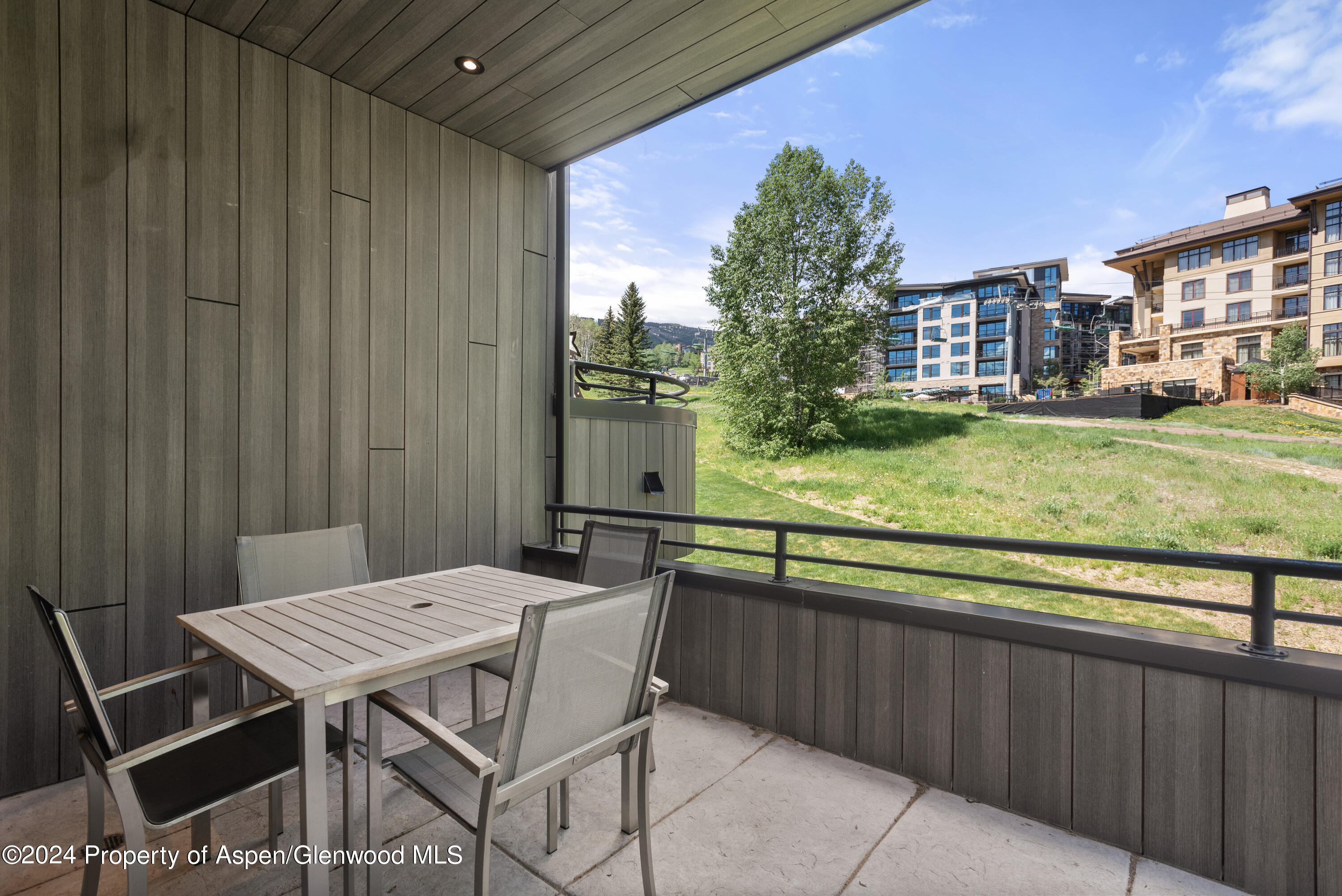 381 Ridge Road, Unit C4 Snowmass Village, CO 81615 - Photo 12 of 43 a view of a patio with table and chairs