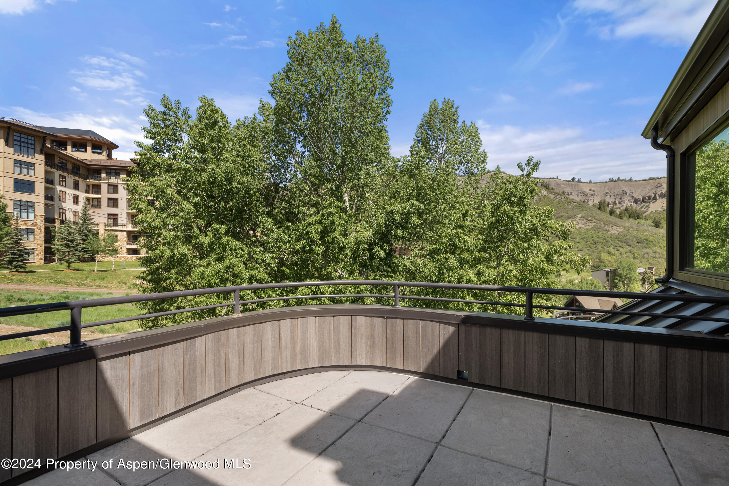 381 Ridge Road, Unit C4 Snowmass Village, CO 81615 - Photo 18 of 43 a view of balcony with wooden floor and outdoor space
