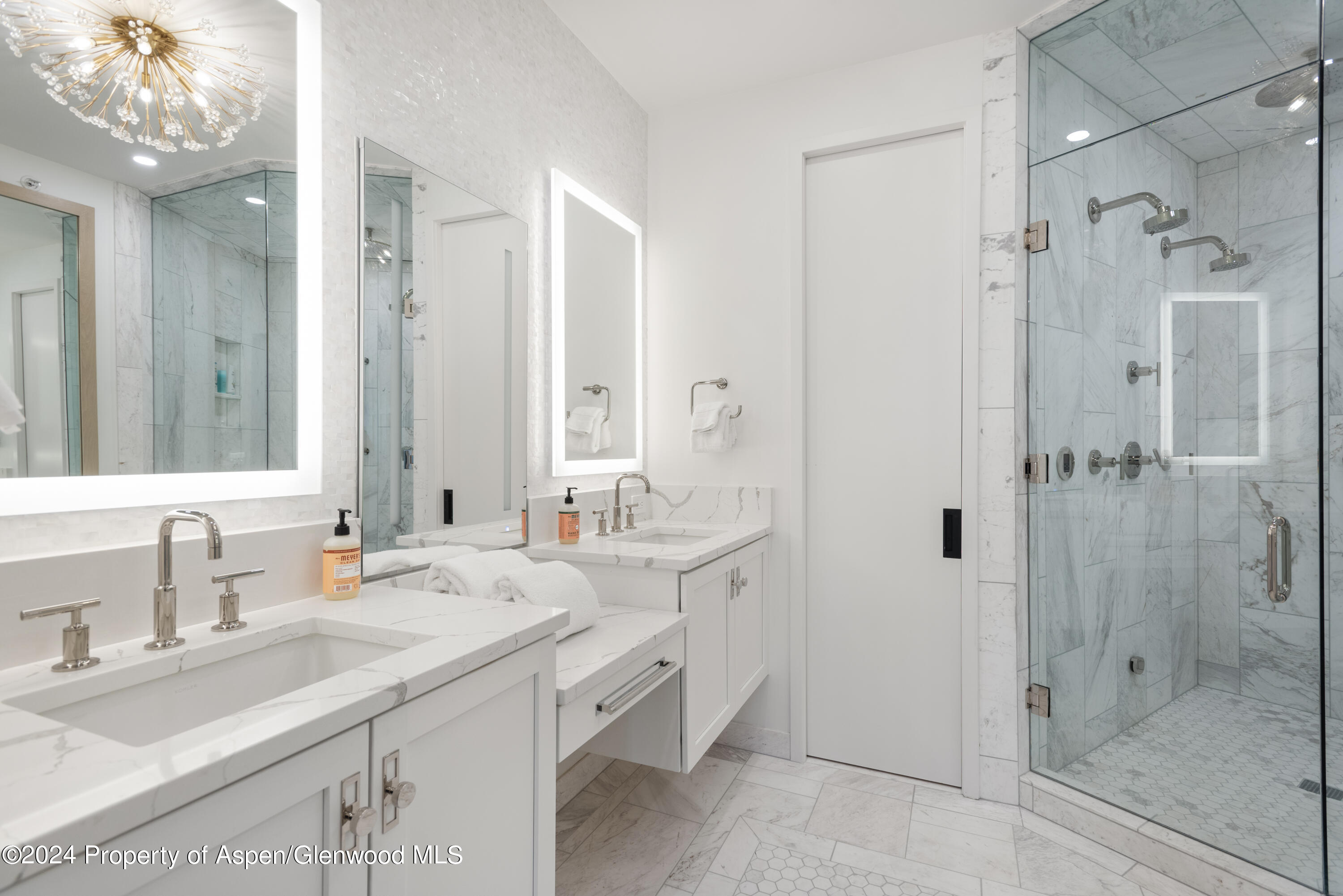 381 Ridge Road, Unit C4 Snowmass Village, CO 81615 - Photo 21 of 43 a bathroom with a double vanity sink mirror and shower