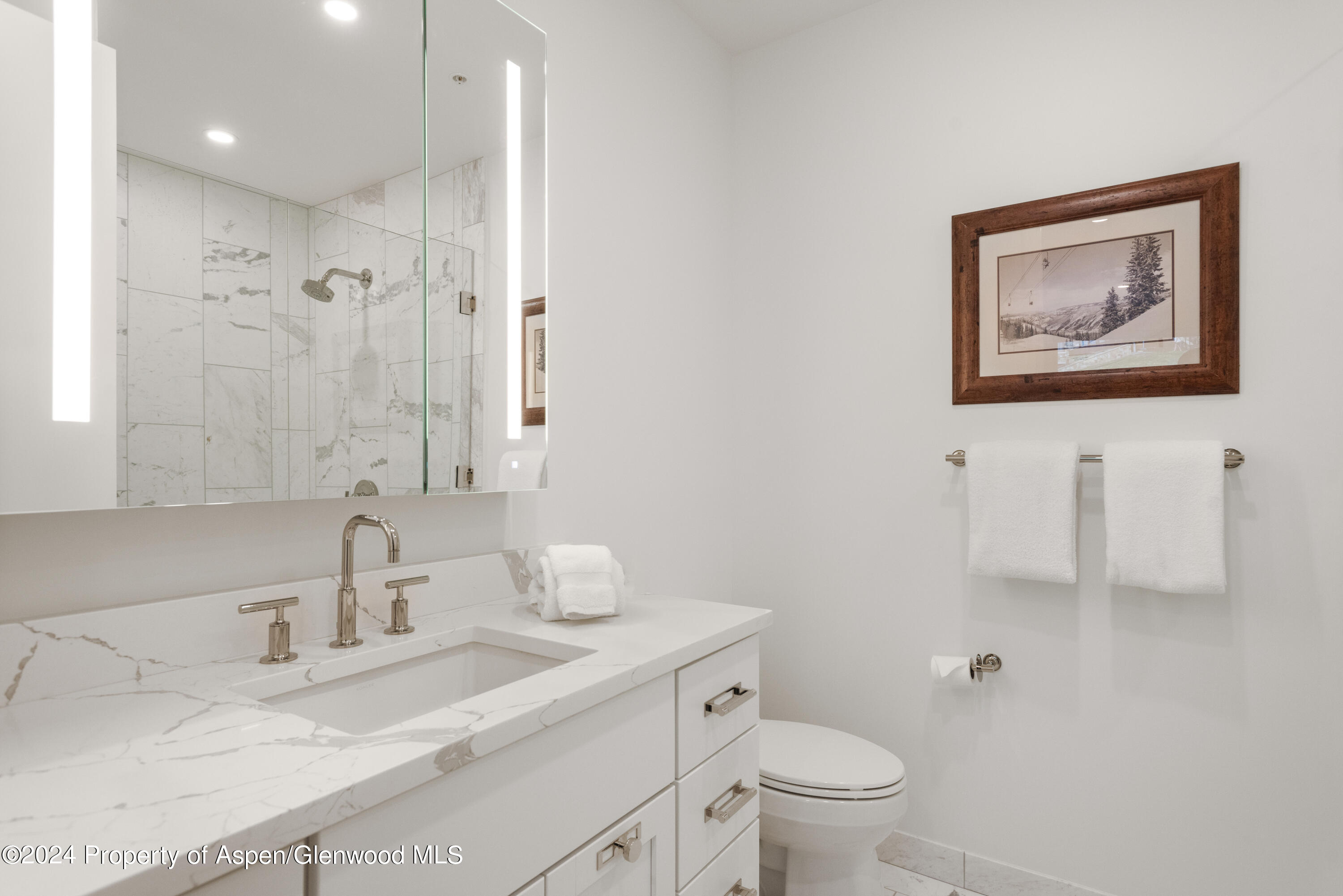 381 Ridge Road, Unit C4 Snowmass Village, CO 81615 - Photo 31 of 43 a bathroom with a granite countertop sink mirror vanity and toilet