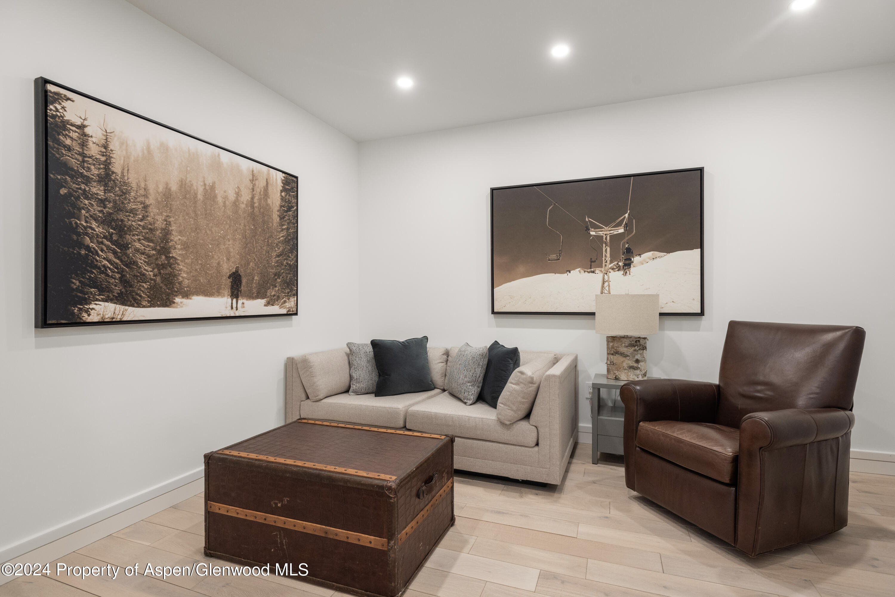 381 Ridge Road, Unit C4 Snowmass Village, CO 81615 - Photo 32 of 43 a living room with furniture and a wall painting