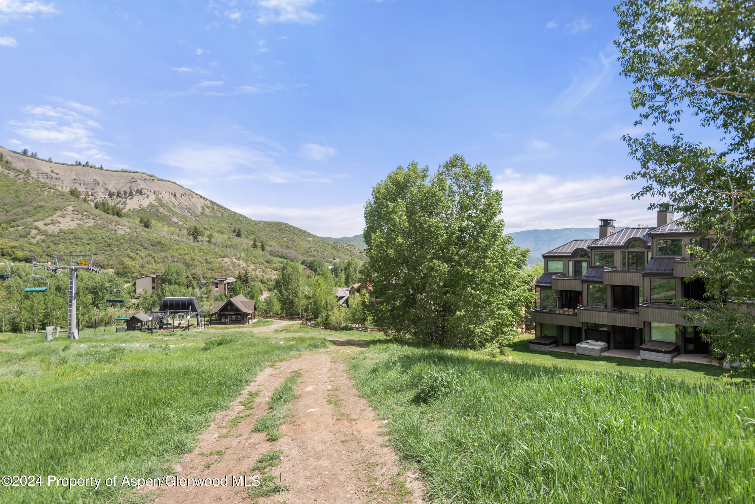 381 Ridge Road, Unit C4 Snowmass Village, CO 81615 - Photo 39 of 43 a view of a garden with houses