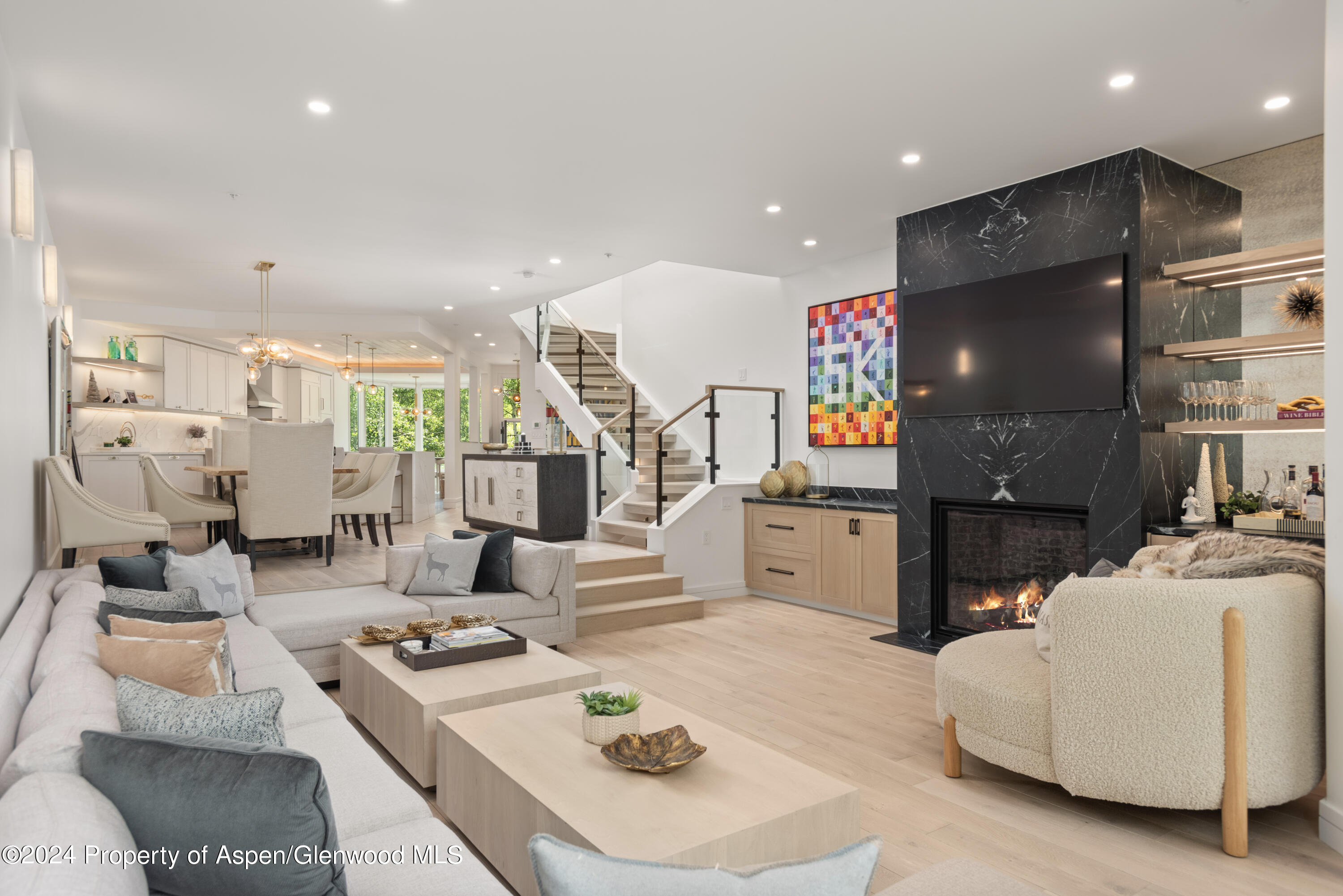 381 Ridge Road, Unit C4 Snowmass Village, CO 81615 - Photo 4 of 43 a living room with furniture and a flat screen tv
