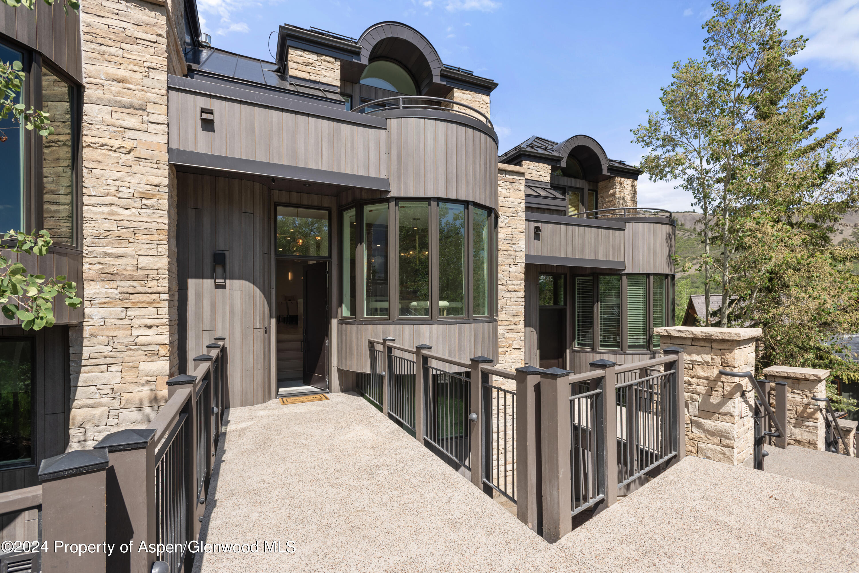 381 Ridge Road, Unit C4 Snowmass Village, CO 81615 - Photo 43 of 43 a view of a patio with table and chairs