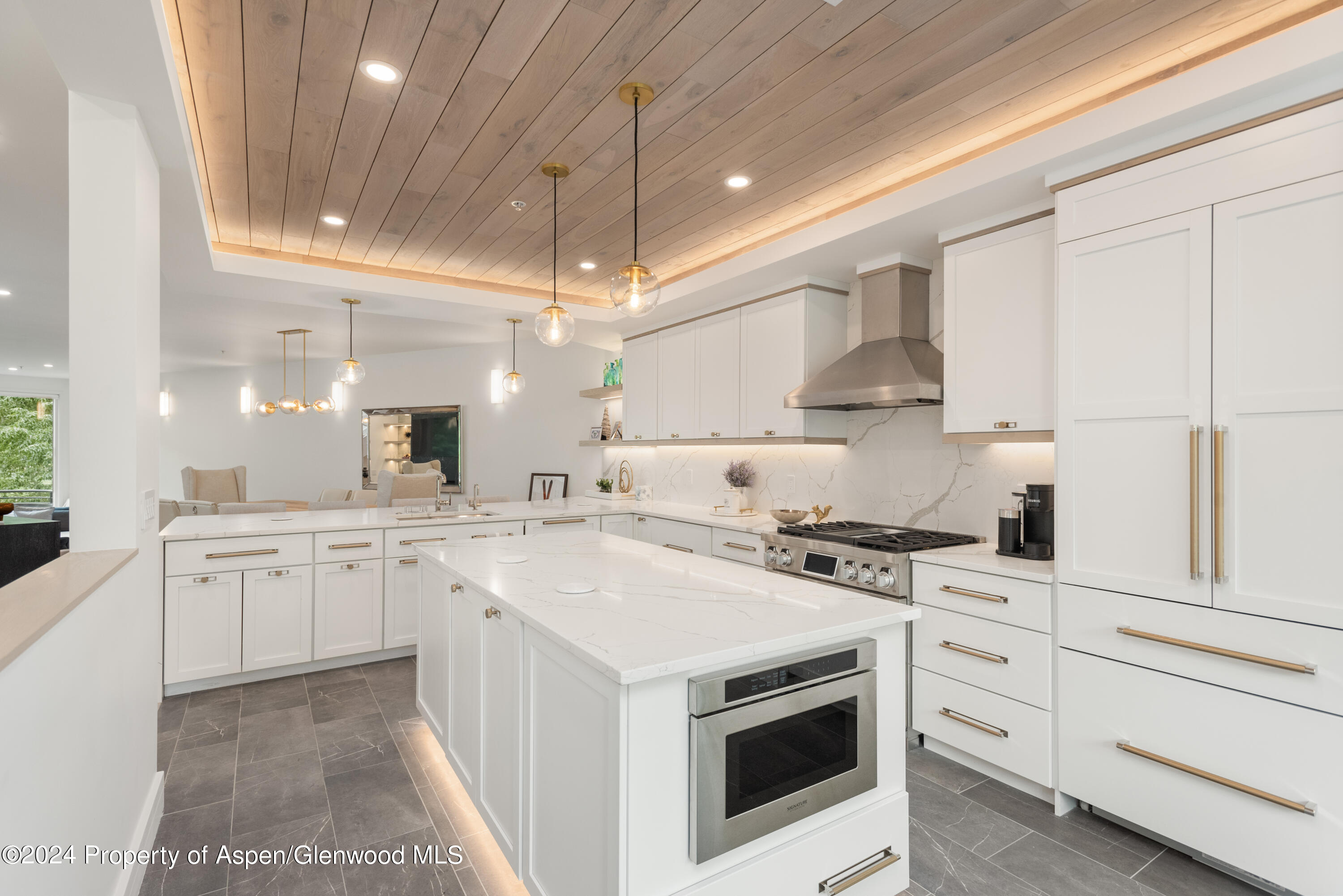 381 Ridge Road, Unit C4 Snowmass Village, CO 81615 - Photo 8 of 43 a kitchen with white cabinets and white appliances