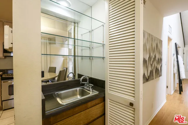 a bathroom with a sink and a mirror