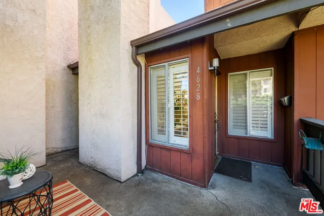a view of front door with outdoor seating