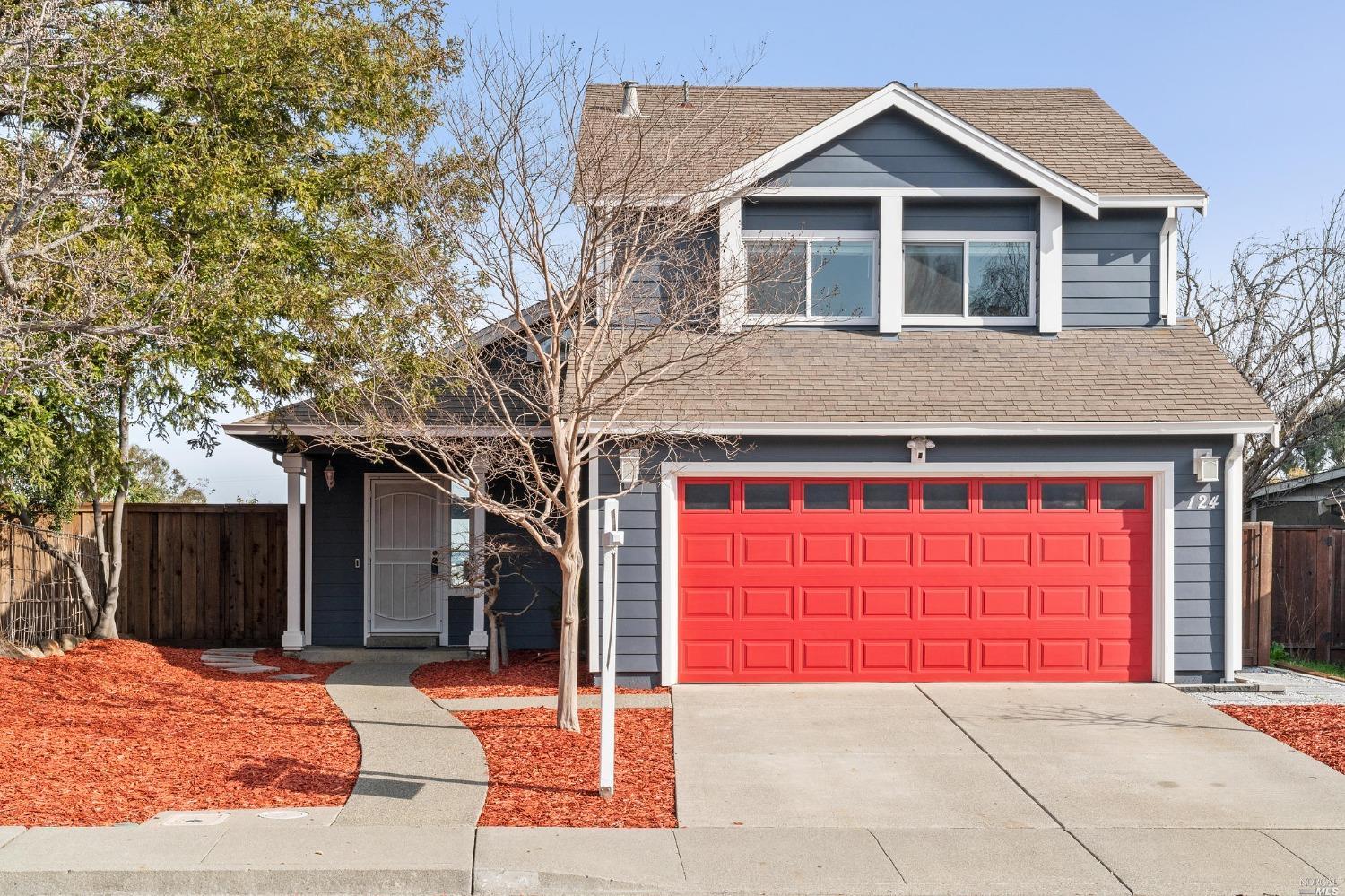 a front view of a house with a garage