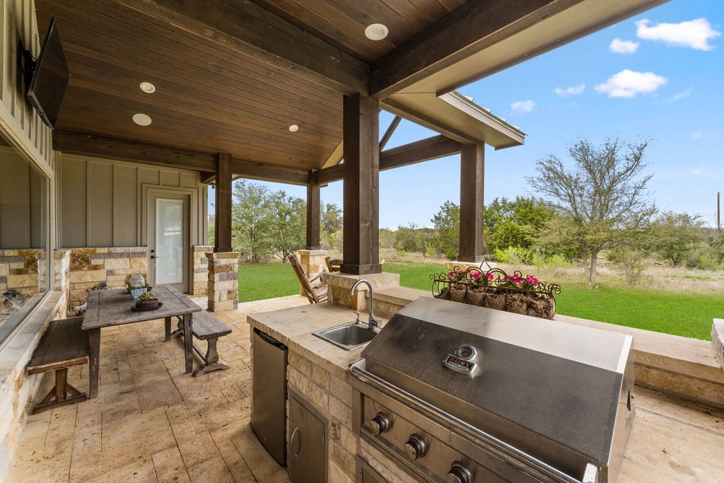 3830 Outback Trail Spicewood, TX 78669 - Photo 30 of 40 a view of a patio with swimming pool
