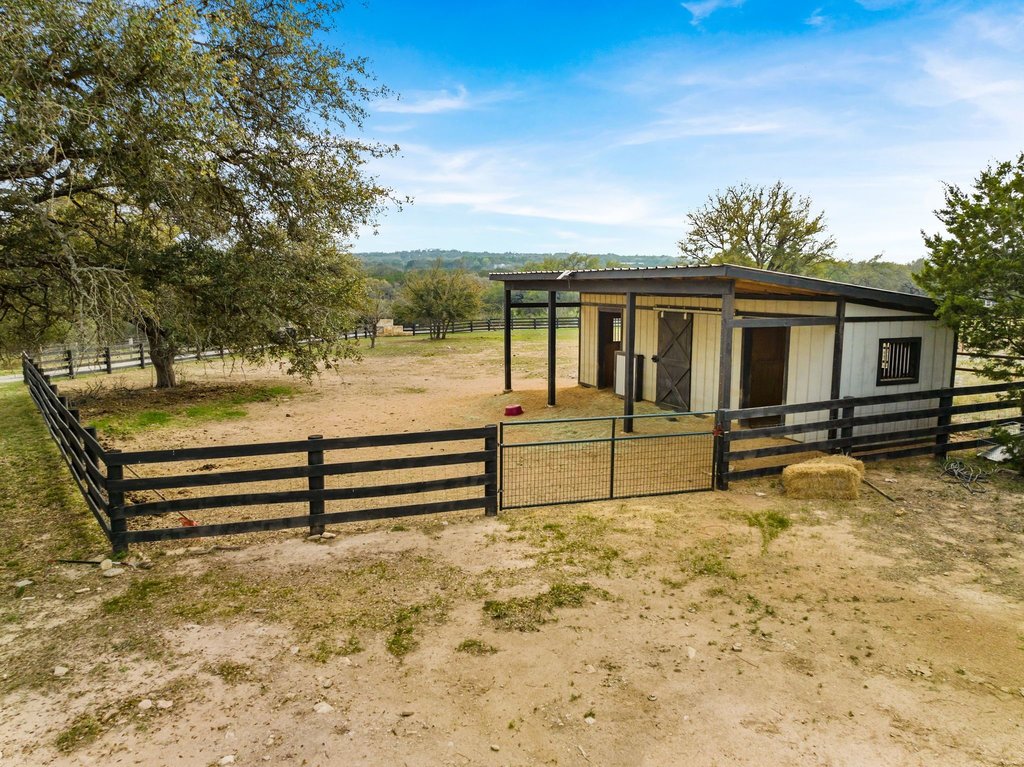 3830 Outback Trail Spicewood, TX 78669 - Photo 36 of 40 a view of a house with wooden fence
