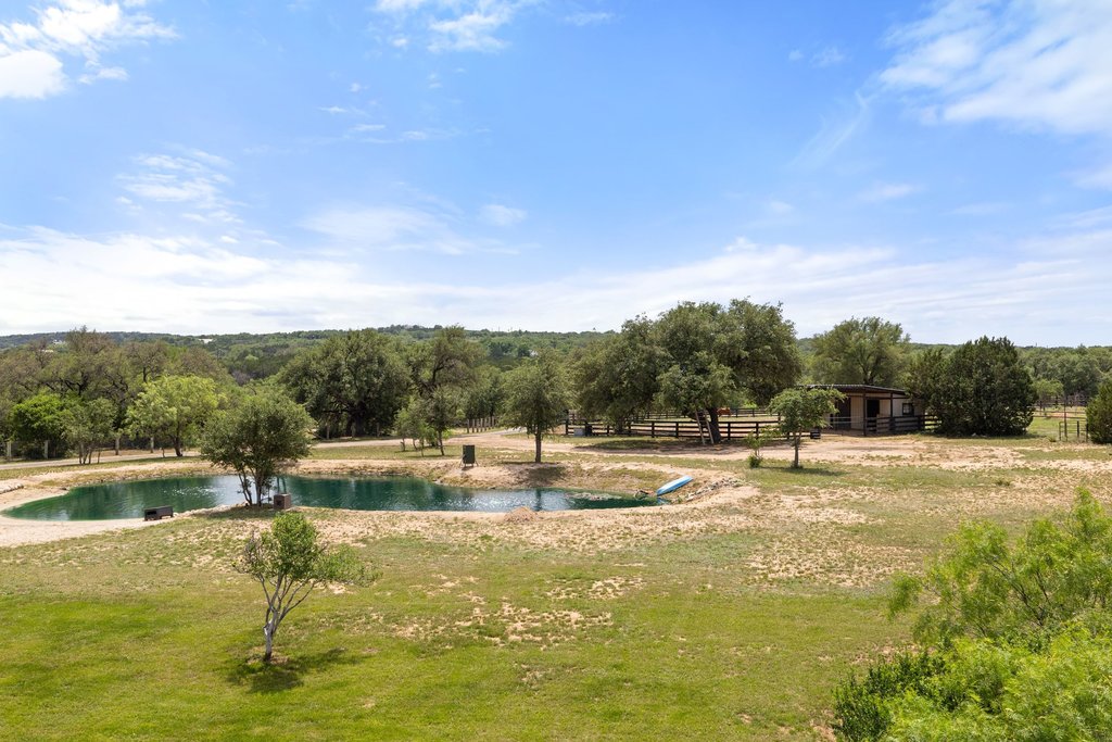 3830 Outback Trail Spicewood, TX 78669 - Photo 39 of 40 a view of a swimming pool with a yard
