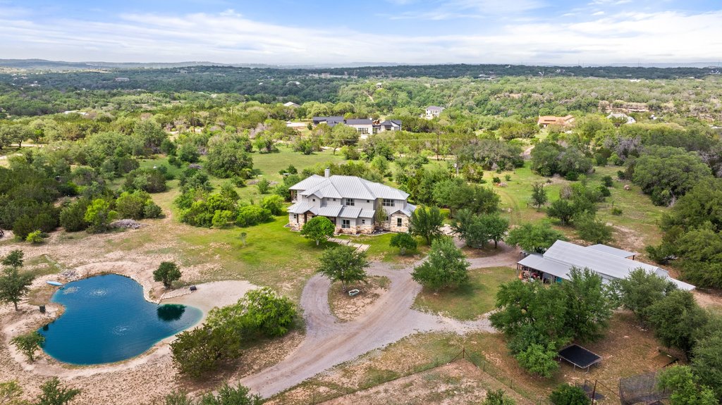 3830 Outback Trail Spicewood, TX 78669 - Photo 4 of 40 a view of a lake with a city