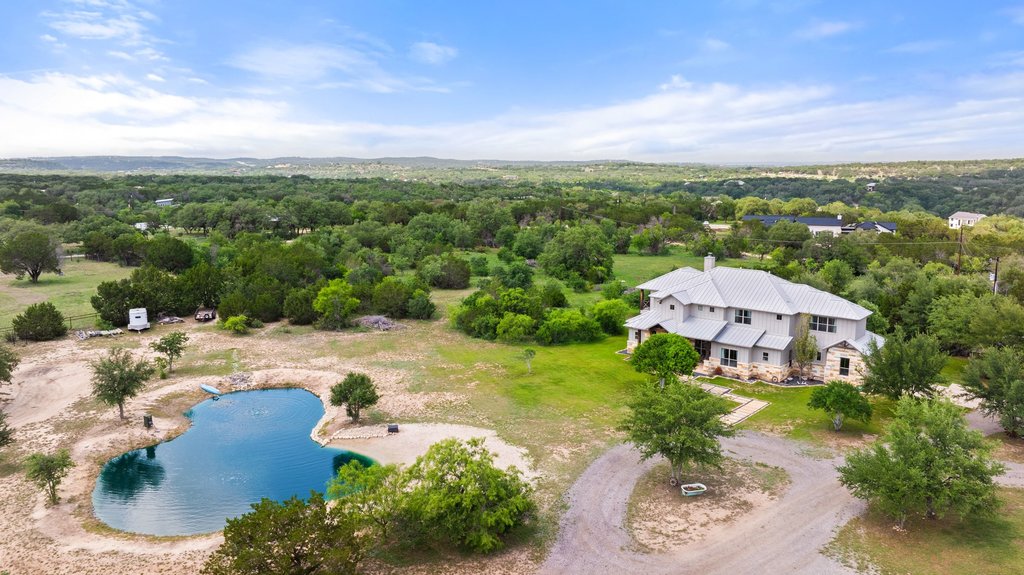 3830 Outback Trail Spicewood, TX 78669 - Photo 5 of 40 an aerial view of a house with garden space and street view