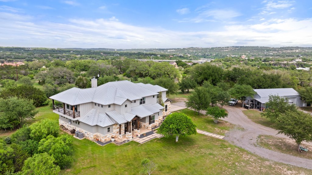 3830 Outback Trail Spicewood, TX 78669 - Photo 6 of 40 an aerial view of a house with a garden