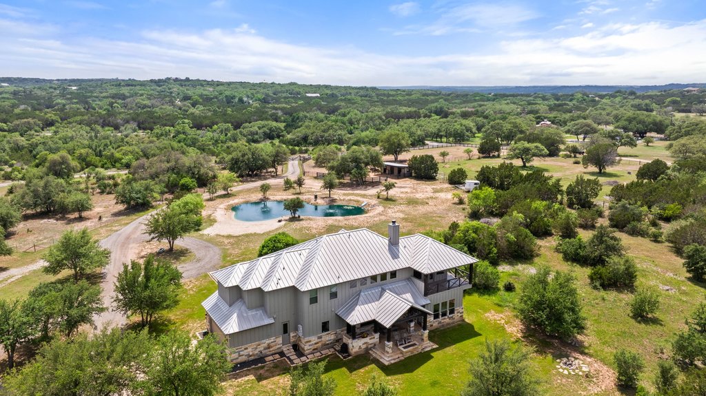 3830 Outback Trail Spicewood, TX 78669 - Photo 7 of 40 a view of a lake in middle of the town