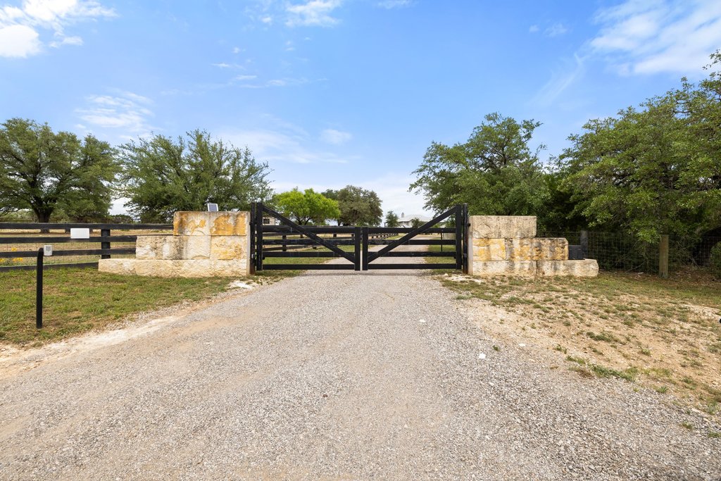 3830 Outback Trail Spicewood, TX 78669 - Photo 9 of 40 a view of a street with houses