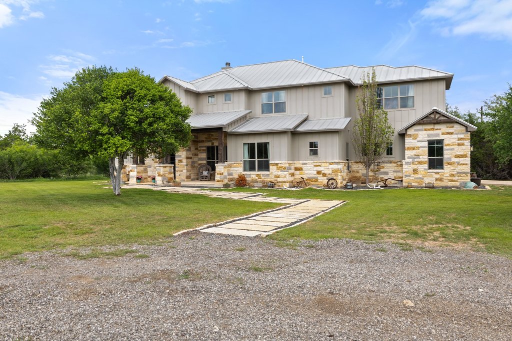 3830 Outback Trail Spicewood, TX 78669 - Photo 10 of 40 a view of house with yard in front of it