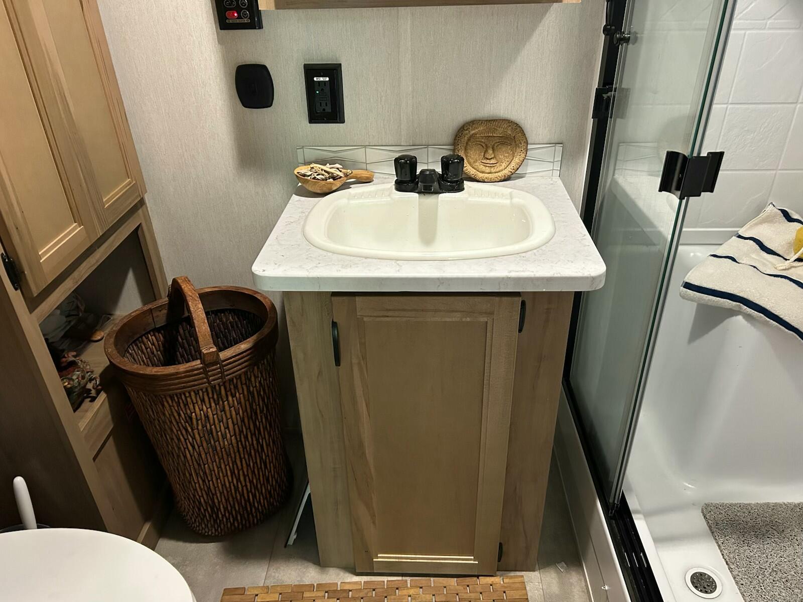 71 South Highland Road, Unit 235 Truro, MA 02666 - Photo 18 of 74 a bathroom with a sink a toilet a mirror and shower