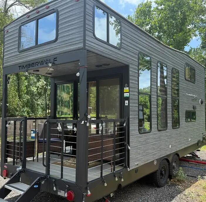 71 South Highland Road, Unit 235 Truro, MA 02666 - Photo 45 of 74 a backyard of a house with barbeque oven table and chairs