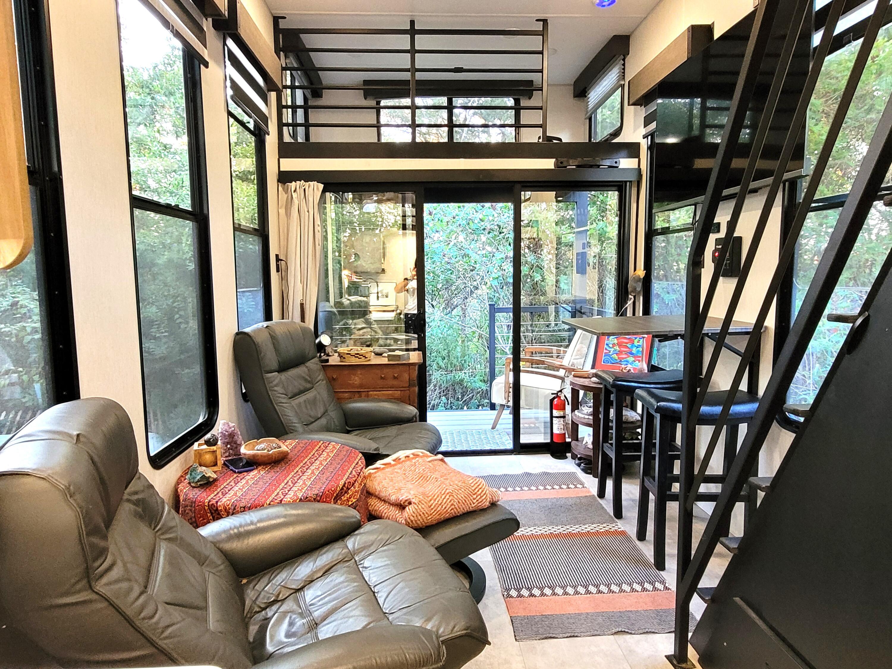 71 South Highland Road, Unit 235 Truro, MA 02666 - Photo 5 of 74 a living room with furniture a rug and a large window
