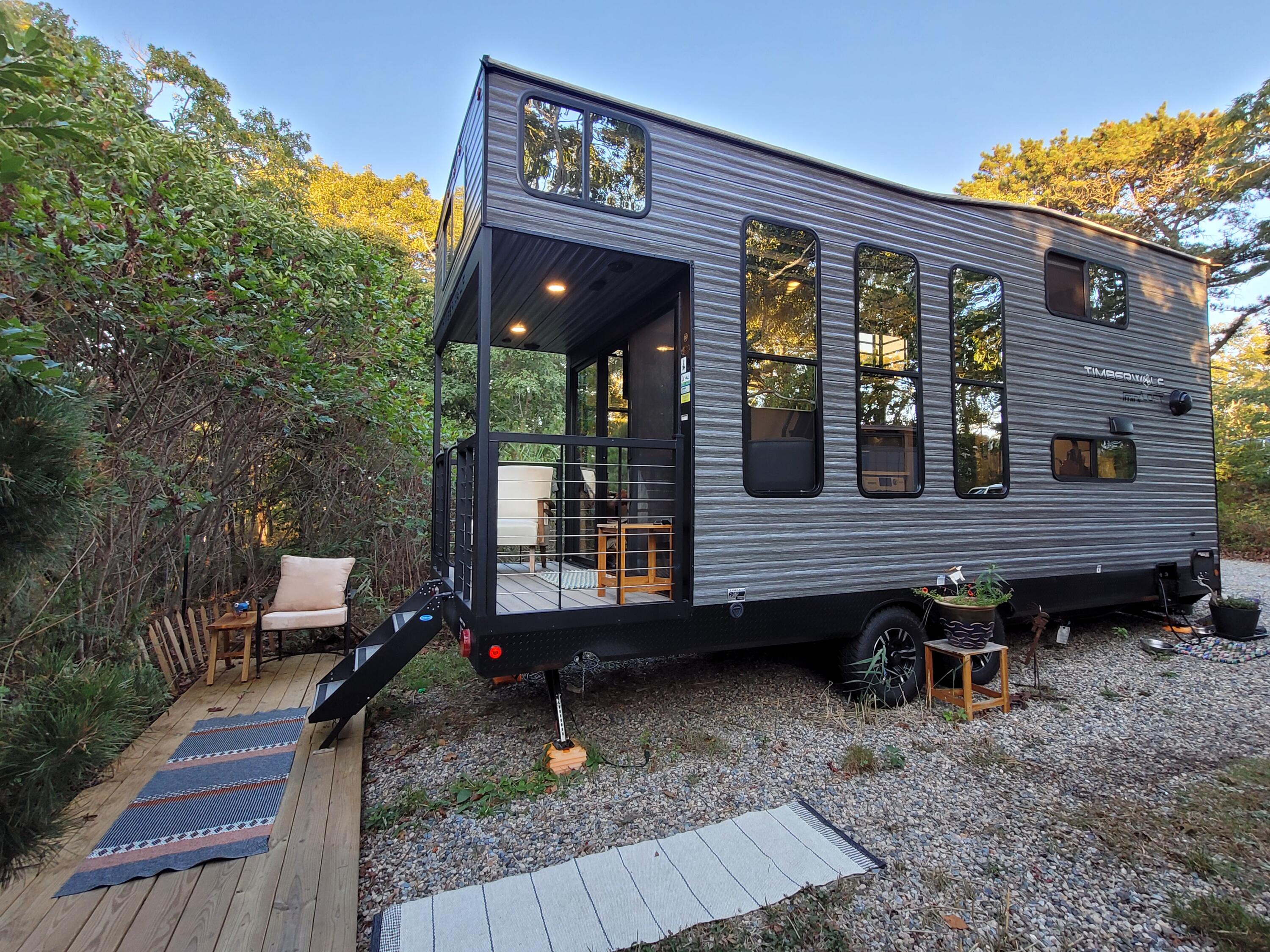 71 South Highland Road, Unit 235 Truro, MA 02666 - Photo 60 of 74 a view of a wooden chairs and a table in the patio